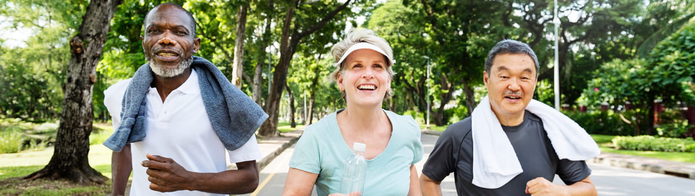 People actively walking together to practice healthy practices as they age. 