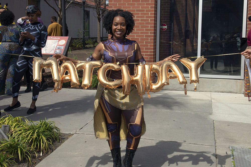 Student with Match Day balloon