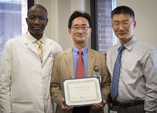 Group shot of 3 international scholars.