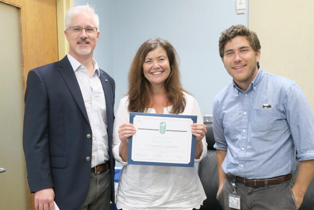 Dr. Carmela Reichel accepts green labs award