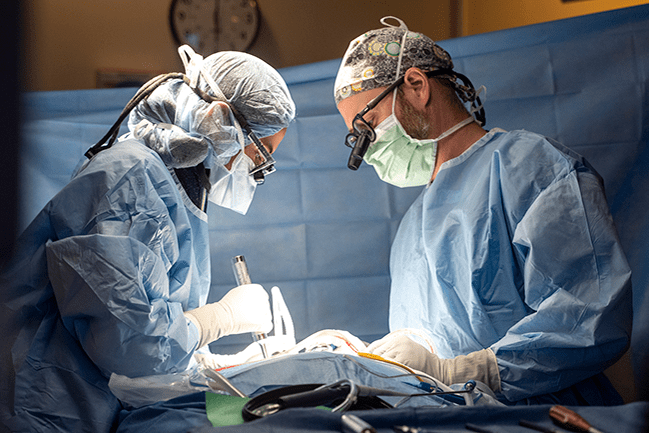 Neurosurgery residents performing surgery
