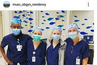 four masked OBGYN residents