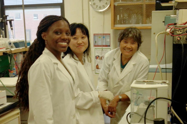 Lab members posing with equipment