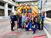 Pediatric Emergency Medicine Fellows Posing With An Ambulance 