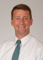 headshot of Dr. John Watts