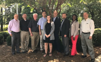 Posed group of faculty and staff outside at a BDSI planning meeting