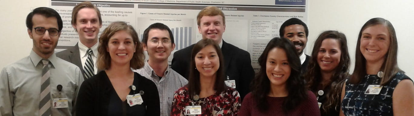 Happy MPH students posing for group picture at their capstone symposium