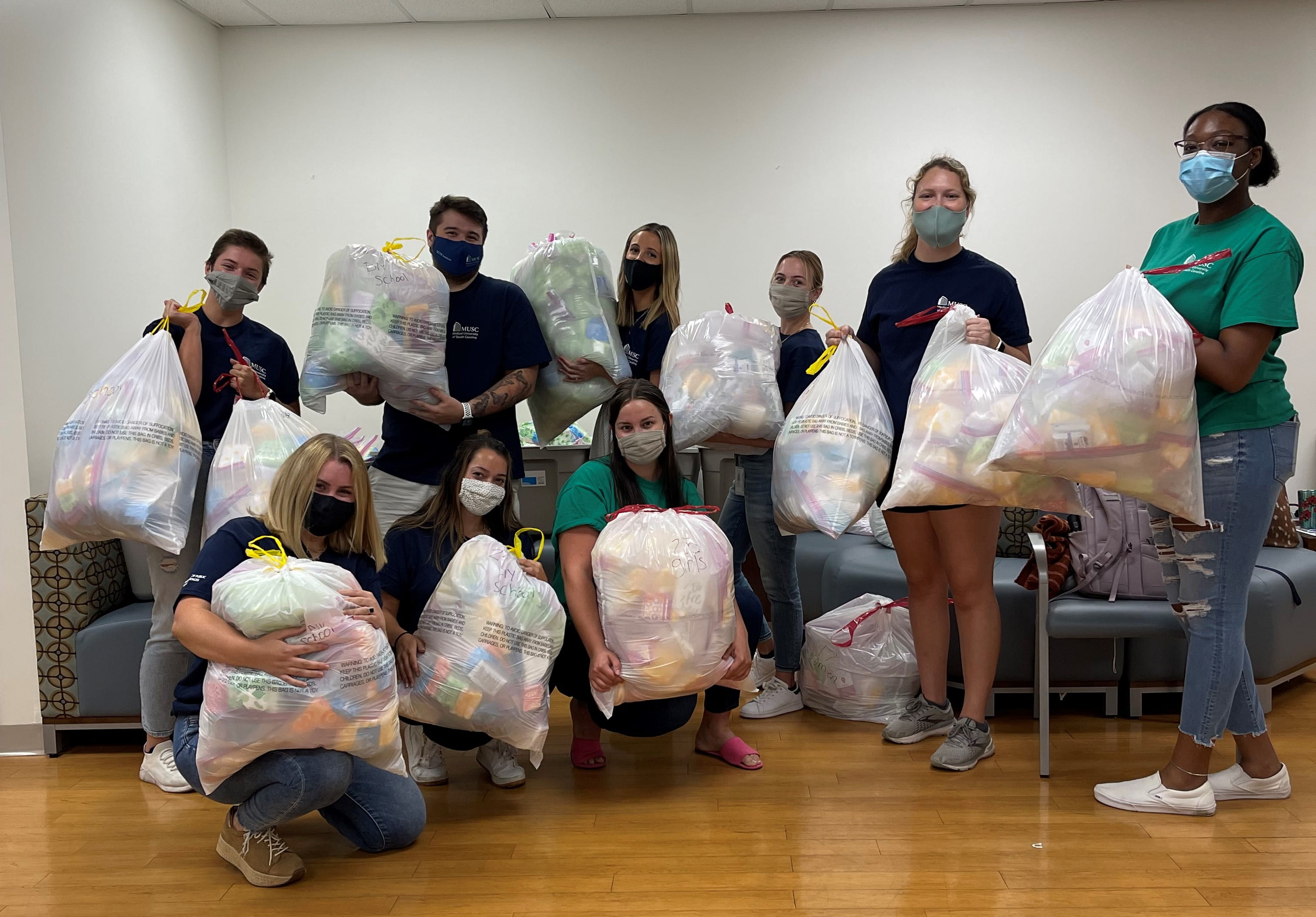 MUSC MPH Students pack feminine hygiene products for women and girls in the Charleston area