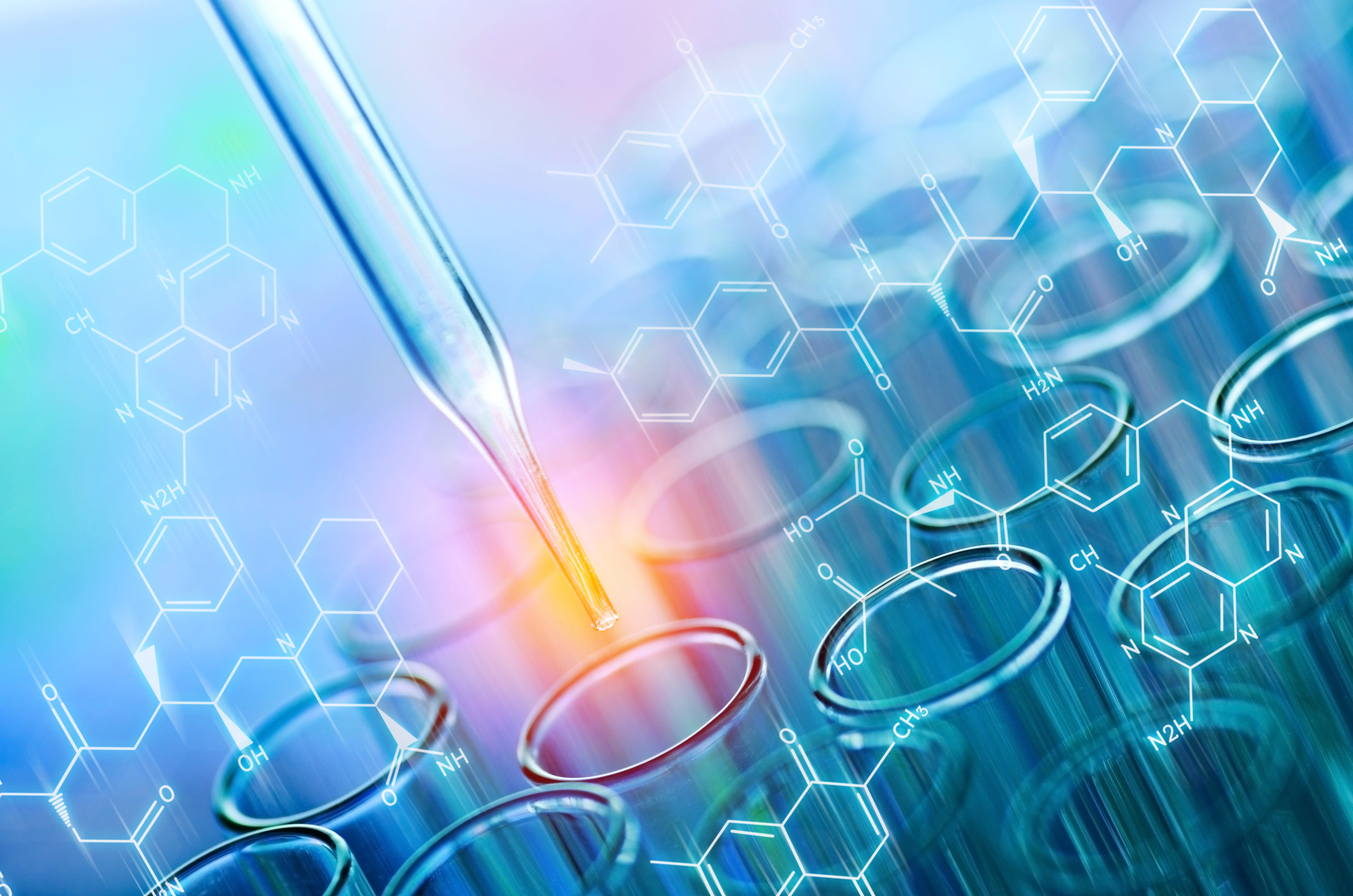 Illuminated syringe entering one test tube in a group of test tubes