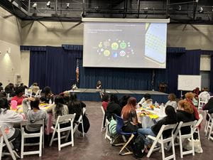 EMPOWERR's Health Educator leading a panel on healthy relationships with high school students