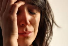 Close up image of a woman crying