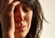Close up image of a woman crying