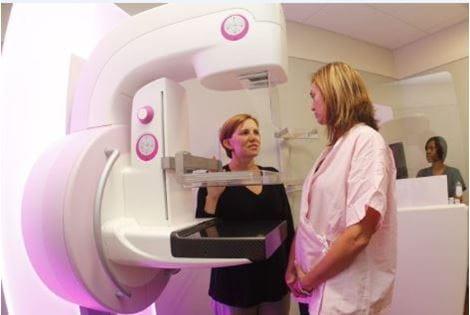 Patient and Radiologist talking during mammogram