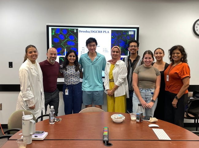 Kourtidis Lab in their lab coats