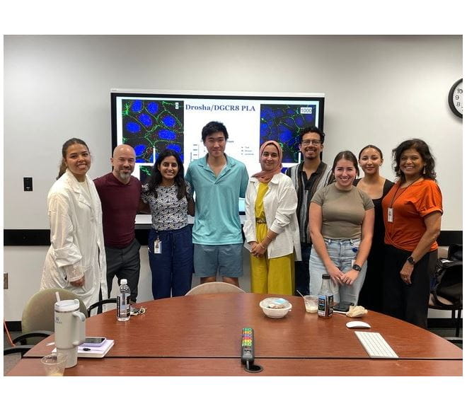 Kourtidis Lab in their lab coats