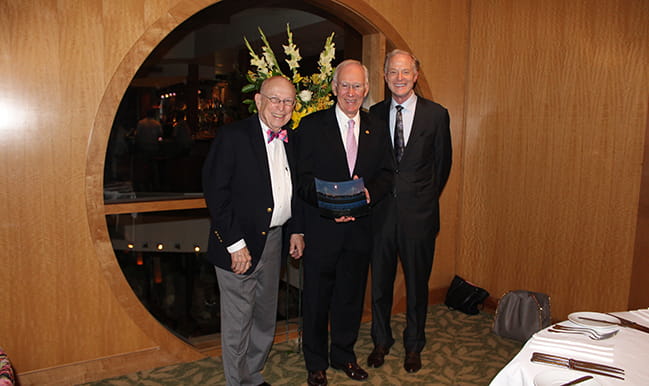 Randy Smoak M.D. accepts the award on behalf of Fred Schild M.D. 