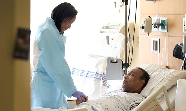 Dr. Vivian Jolley Bea checks on one of her patients, Leon Smith, at MUSC’s Ashley River Tower.
