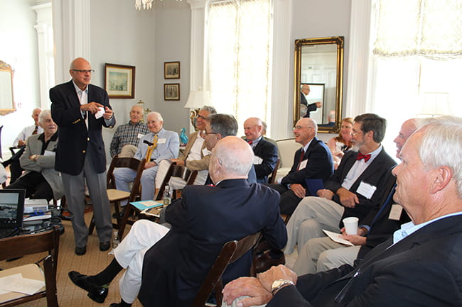 Dr. Raja speaks with fellow retired faculty