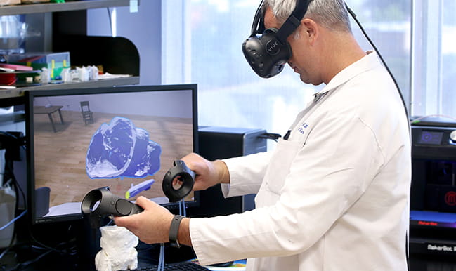 Dr. Evert Eriksson working in virtual reality 