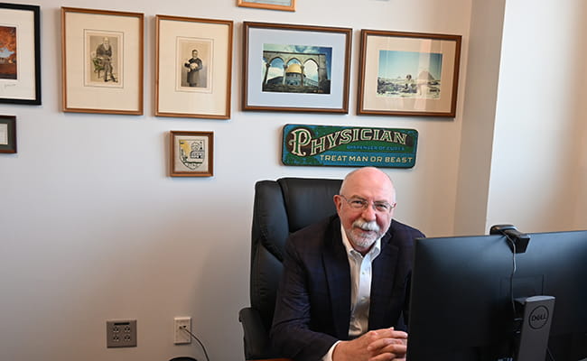Dr. Hughes in his office 