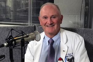 Dr. Thomas Keane at the microphone recording his Health Focus podcast.