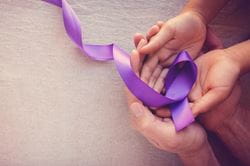 purple ribbon with hands