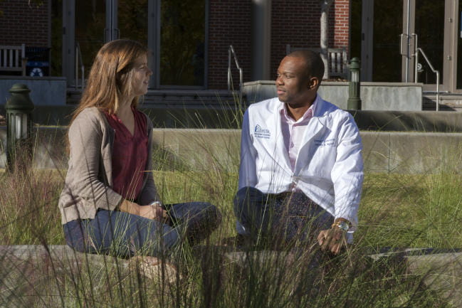 M.D. students sitting outdoors
