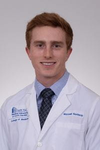 headshot of Max Northrup in white coat