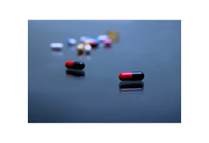 Image of a blue background with pills.