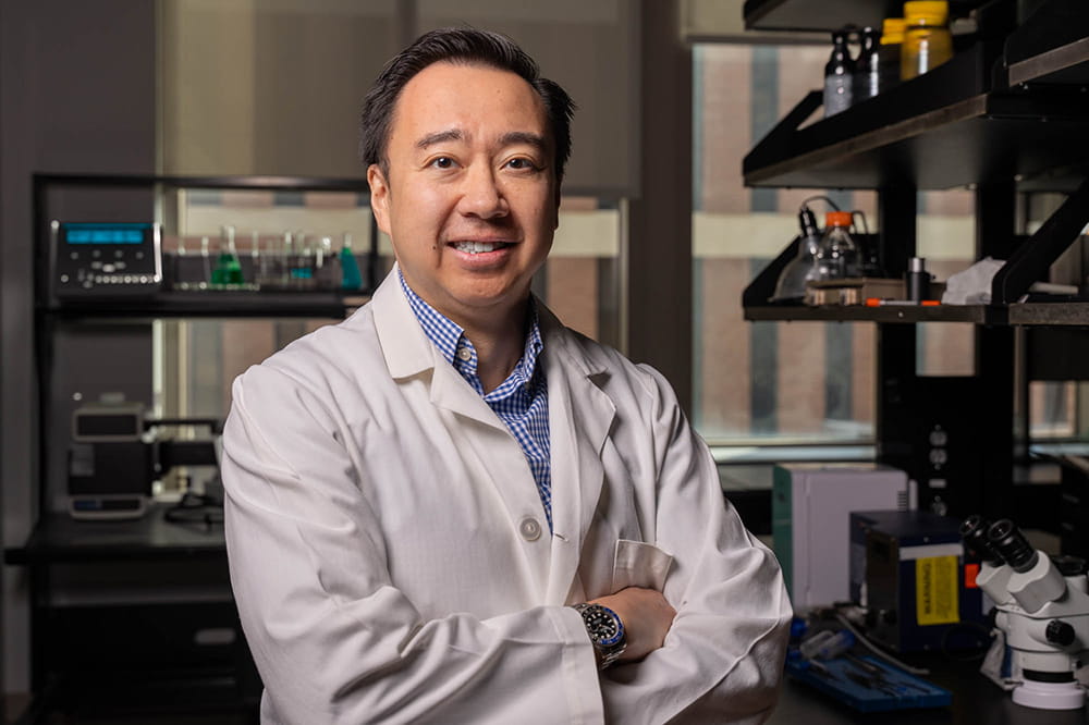 a researcher in a white coat in a lab setting